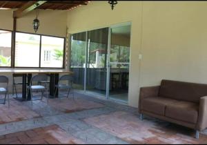 a living room with a couch and a table at Cabañas Hacienda Ridvan in Aguascalientes