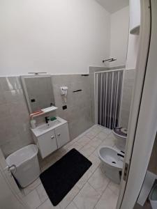 a bathroom with a toilet and a sink at B&B Nonna Pina in Cirò Marina