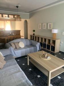 a living room with a couch and a table at Apartment Aura in Argostoli