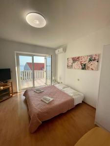 Postel nebo postele na pokoji v ubytování Apartments Marnic