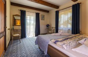 Postel nebo postele na pokoji v ubytování Ruunawere Hotel