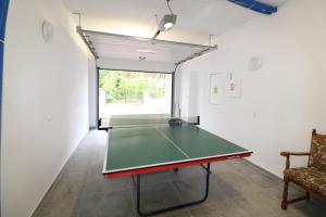 a ping pong table in the middle of a room at RETRO WILLA in Koronowo