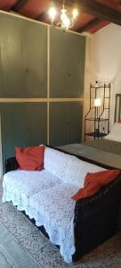 מיטה או מיטות בחדר ב-La Casa del Nonno - Tiny House