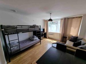 a living room with bunk beds and a couch at Bright and cosy 1 bed flat next to Tower Bridge in London