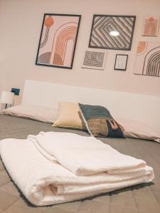 a white blanket laying on the floor in a room at 583slm in Aosta