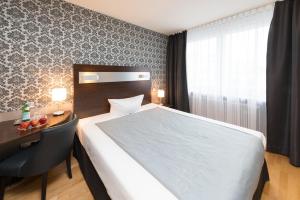 Postel nebo postele na pokoji v ubytování Hotel Munich Inn - Design Hotel