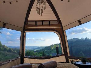 a view from inside of a tent with a window at Glamping Rožnov in Rožnov pod Radhoštěm