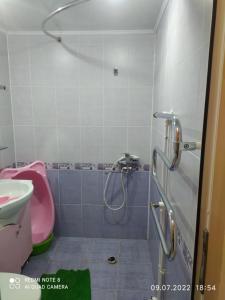 a bathroom with a shower and a sink at Cozy apartment in Sevan City in Sevan