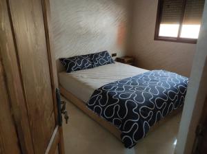 Katil atau katil-katil dalam bilik di Appartements et chambres meublés