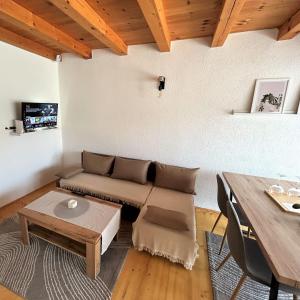 a living room with a couch and a table at Vikendica Farah in Gaj
