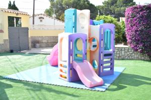 a pile of play equipment in a yard at Villa la Masia in Miami Platja