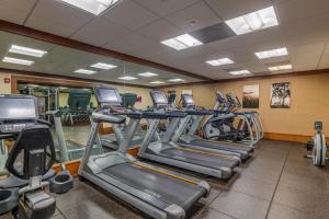 a gym with rows of treadmills and machines at The Whaler Resort in Lahaina