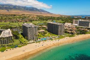 an aerial view of a beach and buildings at The Whaler Resort in Lahaina
