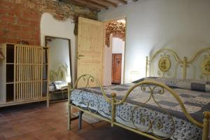 Postel nebo postele na pokoji v ubytování ELBA Borgo di Latrano + 8 fotografií