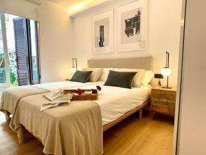 a bedroom with a large bed with a tray on it at APARTAMENTO MENTURA Centro de San Sebastian Parking FREE in San Sebastián