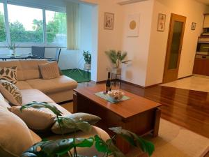 a living room with a couch and a coffee table at Tranquil verde in Matulji