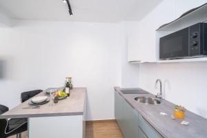 a kitchen with a sink and a counter top at Luxury Villa Salt in Slano