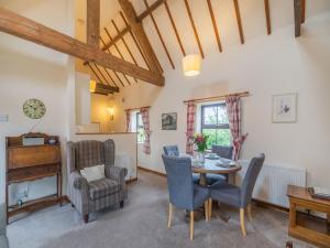 a living room with a table and chairs at The Granary - Uk44490 in Sedgefield