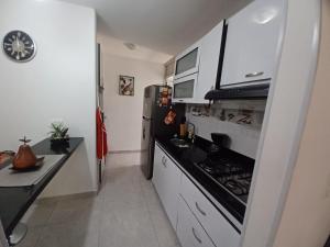 Kuchyň nebo kuchyňský kout v ubytování Reservas del peñon