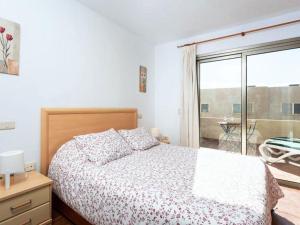 Postel nebo postele na pokoji v ubytování Live Medano Vistamarina Duplex