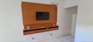 a flat screen tv on a wall in a room at Flat Studio 11 Hotel Fazenda Gravatá-PE in Gravatá
