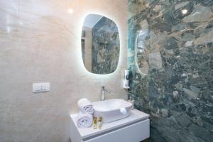a bathroom with a sink and a mirror at Luxury Villa Salt in Slano