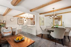 a living room with a table and a dining room at 700 Monarch 201 in Aspen