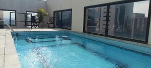 Bazén v ubytování Q-Flat Hotel - Faria Lima nebo v jeho okolí