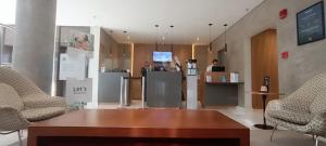 TV a/nebo společenská místnost v ubytování Q-Flat Hotel - Faria Lima