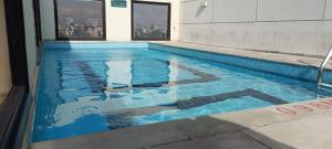 Bazén v ubytování Q-Flat Hotel - Faria Lima nebo v jeho okolí