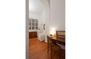 a living room with a wooden floor at B&B Colori di Roma in Rome