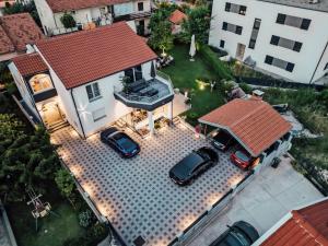 an aerial view of a house with two cars parked at Luxury home apartment Las Palmas in Zadar