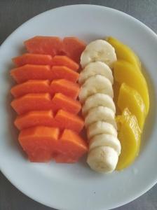 a plate of fruit and vegetables on a plate at HOTEL REALPICO VICTORIA in Duitama