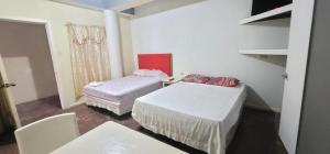 Hotel&Hostal Trinidad客房内的一张或多张床位