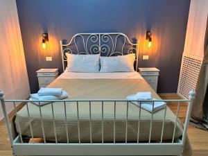 a bedroom with a bed with two towels on it at Roma Chic Flat Monte Mario in Rome