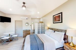 a bedroom with a large bed and a table at Moondance Manor, Unit B in Sedona