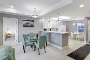 a kitchen and dining room with a table and chairs at On a Point in Lake Ozark