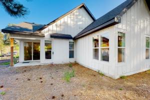 a white house with large windows at Cozy in Cascade in Cascade