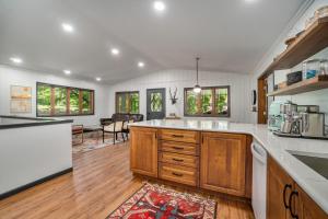 a kitchen with white counter tops and wooden cabinets at Maplewood in Thompsonville