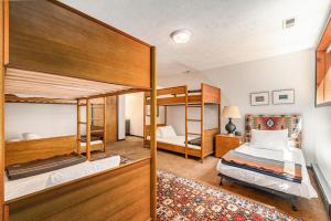 two bunk beds in a room with a bedroom at Maplewood in Thompsonville