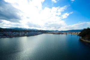 a view of a river with a city at caffel Hina-no-sato in Hita