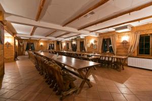 a large room with a long table and chairs at Gród Piasta in Gąsawa