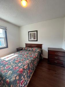 a bedroom with a bed and a dresser in it at Shore Beach Houses - 52 - 406 Porter Avenue in Seaside Heights