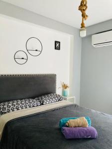 a bedroom with a bed with a stuffed animal on it at Altos de Barrio Sur in San Miguel de Tucumán