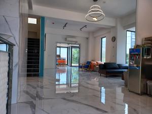 a living room with a large marble floor at 111 Gukeng Homestay 