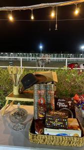 a table with a tray of food and snacks at اسطبلات أساور للفروسية Asawer Equestrian Stables 