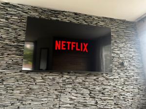 Televiisor ja/või meelelahutuskeskus majutusasutuses Apartamento con Excelente Ubicación en Envigado