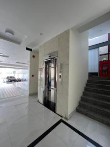 an elevator in a building with a staircase at Khách sạn Thiên Minh - Dốc Lết in My Luong +41 photos