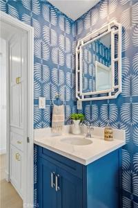 a bathroom with a sink and a mirror at Amazing location! Luxurious beach cottage.Ocean views in Manhattan Beach