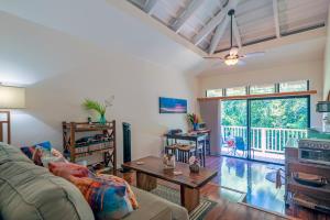 a living room with a couch and a table at Spacious Princeville studio in Princeville